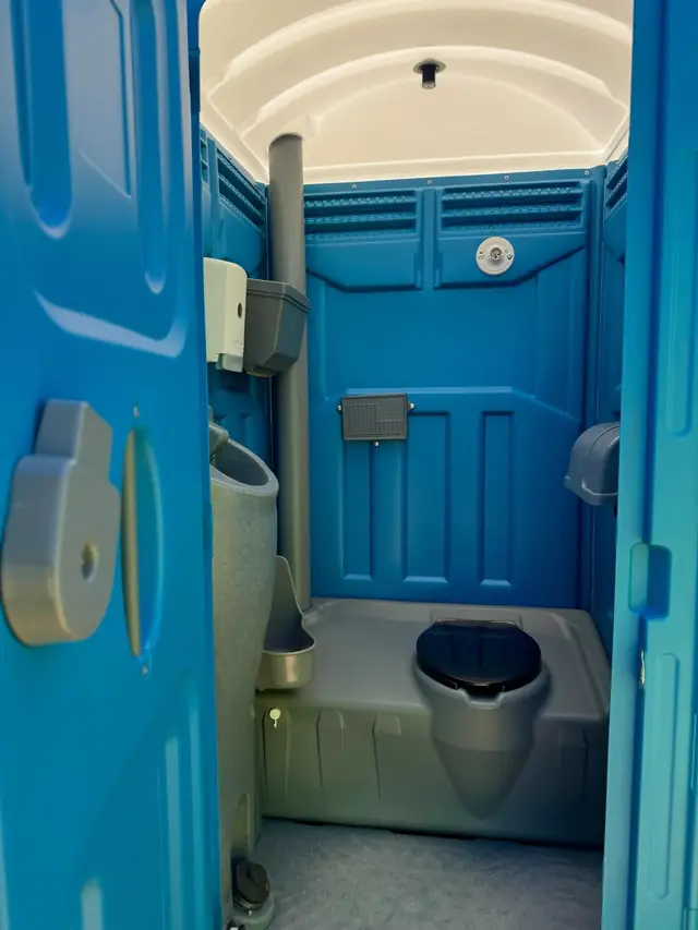 Clean porta potty interior after a service visit