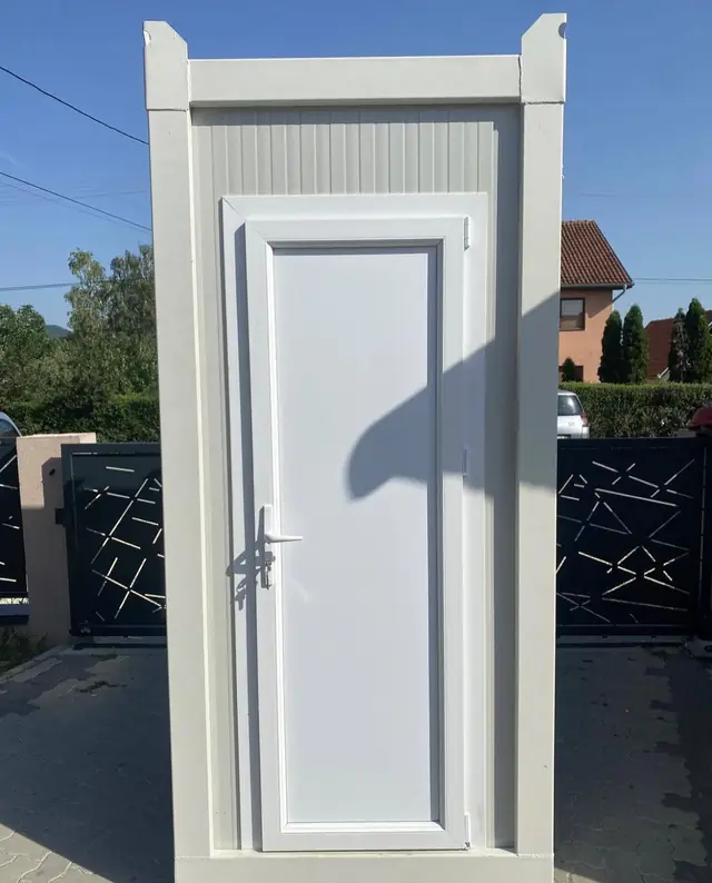Door of a white VIP restroom cabin