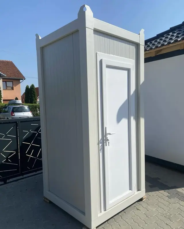 Side view of a white luxury restroom cabin
